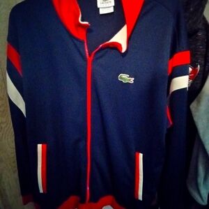 #Lacoste jacket WELL KNOWN  BRAND NAVY WHHITE AND RED ZIPPERED  FRONT size el